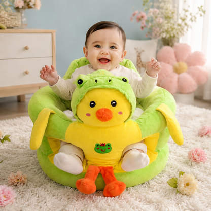 Child sitting in a green and yellow plush toy with a frog design on a carpeted floor.